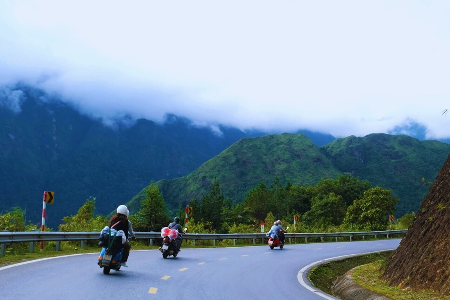 Riders on a Vietnam motorbike road trip along winding mountain routes